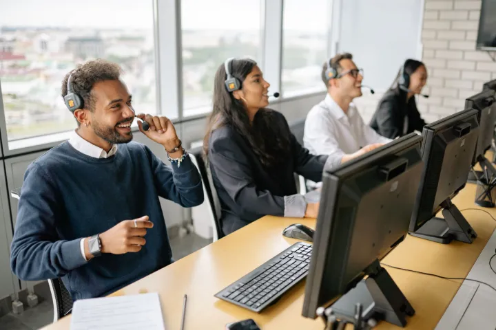 support team on calls with computers