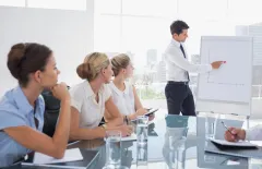 Business man presenting at a meeting