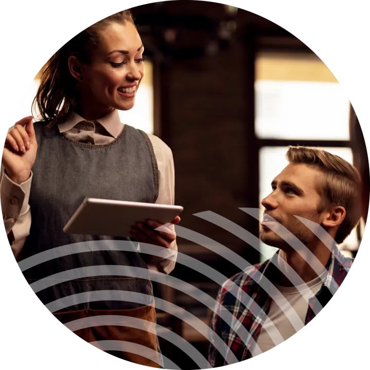 woman using irish connectivity solution in busy restaurant