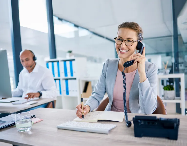 Woman in -office on a phone