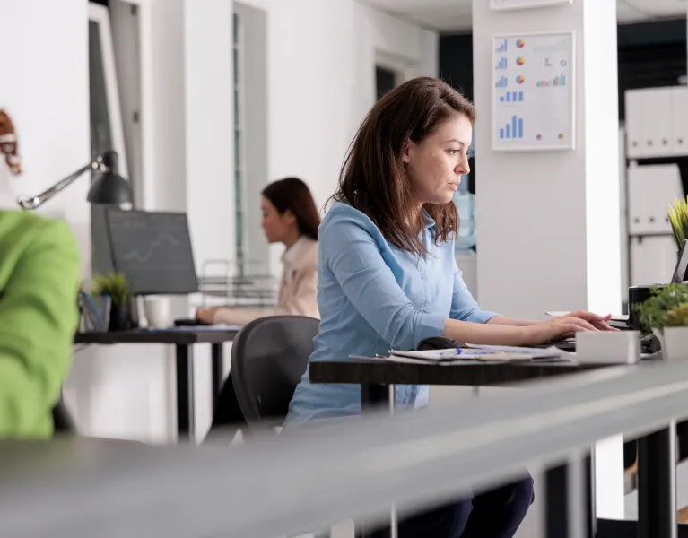 Woman typing laptop modern office
