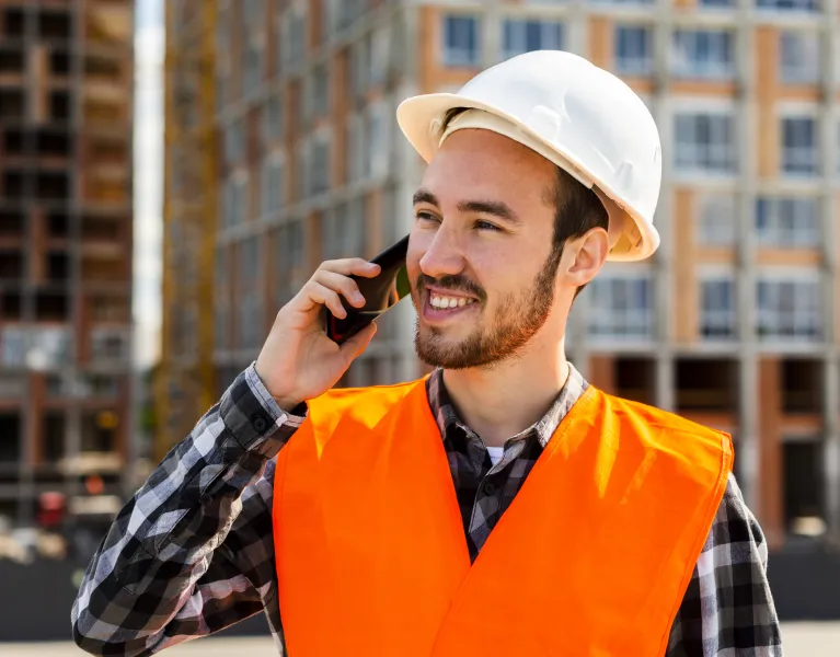 Irish Construction Induistry professional phone and communications solution  engineer on phone Ireland building site